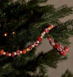 a close up of a christmas tree with ornaments on it