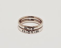 "These Stainless Steel rings are super shiny and a petite 3 mm wide, with a rounded edge. The letters y, p, and j do NOT do well on this rounded ring therefore I suggest if you have these letters in your name that you order the 3 mm flat ring available on my page. These rings are comfortable for stacking up to 4 rings. I can personalize with names, dates, quotes or roman numerals or scripture. Great to wear with your diamond or use as a thumb ring also. These rings also come in Gold and Rose Gol Custom Name Adjustable Open Ring, Custom Name Adjustable Stackable Rings, Adjustable Stackable Rings With Custom Name, Dainty Personalized Stackable Rings, Dainty Personalized Stackable Rings Adjustable, Dainty Personalized Initial Ring With Round Band, Dainty Personalized Stackable Adjustable Rings, Dainty Personalized Round Band Jewelry, Personalized Dainty Initial Ring