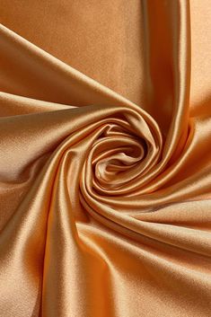 a close up view of an orange satin fabric