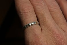 "Solid sterling silver floral stacker band made to order in your size. Dimensions: .113\" x .057\" (2.87 x 1.45mm) Ring Size. Made to order in your size. Please check my shipping polices for processing time. Tazzie's Custom Jewelry is just one chick and a torch! I have quite the variety of handmade sterling silver natural stone jewelry. Everything in my shop I handcraft to last a lifetime. I also love custom orders, feel free to contact me with any questions. Thank you for your interest in my ha Silver Stackable Bands For Anniversary, Adjustable Silver Stackable Rings With Diamond Cut, Adjustable Stackable Silver Rings With Diamond Cut, Adjustable Engraved Round Bands, Adjustable Engraved Bands, Adjustable Engraved Band, Wedding Bands With Etched Detail And Adjustable Fit, Silver Eternity Band With Diamond Cut, Adjustable Etched Wedding Bands