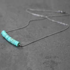 "Seventeen 8mm natural summer sky blue turquoise smooth rondelle disks with hints of green and warm copper glints securely wrapped with recycled fine silver, suspended from recycled sterling silver cable chain and oxidized for an organic, rustic look. The necklace drapes an elegant 18\" (or 20\") in length including the sterling silver lobster clasp. All jewelry comes suitably packaged for gift giving. Come see more of my shop: http://www.etsy.com/shop/TheSlyFox Everything you see here is made b Nickel-free Blue Turquoise Necklace With Round Beads, Minimalist Turquoise Nickel-free Necklace, Minimalist Turquoise Wire Wrapped Jewelry, Minimalist Blue Beaded Turquoise Necklace, Everyday Minimalist Turquoise Necklace, Blue Turquoise Necklace With Wire Wrapped Round Beads, Blue Turquoise Wire Wrapped Necklace With Round Beads, Everyday Turquoise Jewelry With Spacer Beads, 14k Gold Wedding Ring