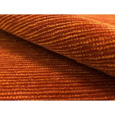 an orange colored fabric with wavy lines