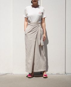 "Beat the heat with this cool loose cotton wrap pants Wide-leg fit is easy and casual with waist tie to give more shape Constructed to tie around waist It simply is super comfortable to wear and easy to pair with any summer tops -Made of light cotton -Sits on natural waist -Wrap around tie -Relaxed fit -24\" inseam *Material- cotton *Care-Machine Wash cool delicate / No chlorine bleach / Tumble Dry low / cool iron *Mode is 26\" waist, 36\" hips, and 5'3\" and she is wearing size small *See the r Wrapped Pants, Wide Leg Summer Pants, Wrap Skirt Pants, Beige Trouser, Beige Hose, Dark Brown Pants, Summer Linen Pants, Everyday Skirts, Maxi Pants