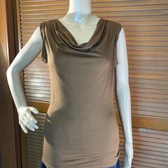 Never Worn Size Xs Top. Measurements Taken Laying Flat Approximately: Bust - 17”, Length - 25” Fitted Sleeveless Brown Top, Fitted Sleeveless Casual Top, Casual Fitted Sleeveless Tops, Brown Casual Sleeveless Tank Top, Casual Brown Sleeveless Tank Top, Sleeveless Brown Cotton Top, Sleeveless Brown Top For Spring, Brown Sleeveless Top For Spring, Fitted Brown Sleeveless Blouse