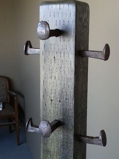 an old wooden door with metal handles and knobs