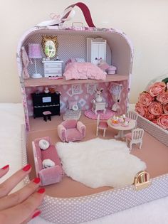 a doll house with furniture and accessories in it