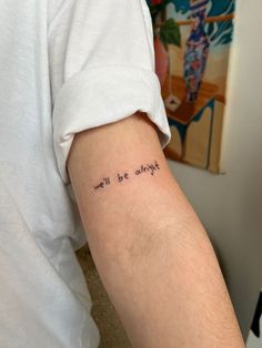 a person with a tattoo on their arm that says, will be alright