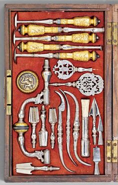 an old wooden box filled with different types of tools