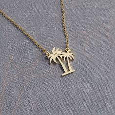 This Palm Tree Necklace is a beautiful reminder of Florida's coastal charm. Crafted with care, this necklace can be customized with a name, making it a perfect, personal keepsake. Whether you're a Florida native or simply love its sunny vibes, this necklace is a thoughtful tribute to the state's natural beauty and tropical spirit. - All the designs can be made as necklace, bracelet, and earrings. If you also want a complete set that includes a necklace, a bracelet and earrings please get in touch with us. We accept custom orders! - 925 sterling silver and 14k solid gold options are available. - For 14k solid gold necklace, the total weight of the necklace can be between 1 and 3 grams. - For sterling silver items: To protect the necklace from fading and tarnishing keep it away from chemical Palm Tree Necklace, Sunny Vibes, Silver Items, Coastal Charm, Solid Gold Necklace, Tree Necklace, Wedding Jewellery Necklace, Necklace Sterling Silver, Wedding Necklace