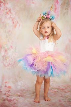 Specially designed for babies and toddlers, this mini Rainbow Unicorn Birthday Dress is perfect for birthday parties, photo shootings, Halloween, pageants and for many other occasions. It is both charming and play friendly. It has a fluffy tutu skirt made of plenty layers of pastel rainbow colors and the bodice has a charming heart-shaped opening detail and a zipper on the back. It is made of highest quality non-allergic mikado, satin and plenty layers of tulle, and embellished with applique seq Unicorn Birthday Dress, Pastel Rainbow Colors, Unique Couple Halloween Costumes, Rainbow Unicorn Birthday, Elsa Dress, Unicorn Costume, Unicorn Dress, Baby Unicorn, Toddler Costumes