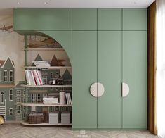 a room with green cupboards and bookshelves in front of a wall mural