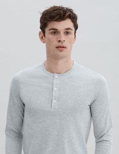 Our long sleeve three-button henley is unmistakably refined, yet subtle. It is destined to be an invaluable addition to your wardrobe given its versatility. Extremely soft, lightweight and elegantly fitted, making it a perfect option for layering or wearing it on its own.

Crafted from our premium lightweight jersey fabric — superfine two-fold (80/2) yarn made from the finest extra long staple Peruvian Pima cotton. Detailed with Mother of Pearl håndværk buttons.

We recommend that you take your Classic Fall Henley With Button Cuffs, Fall Layering Henley With Buttons, Gray Long Sleeve Tops With Button Closure, Solid Long Sleeve Henley With Buttons, Classic Button-up Henley With Buttons, Long Sleeve Henley With Buttons For Fall, Classic Long Sleeve Henley For Spring, Fitted Casual Henley With Button Closure, Classic Henley For Fall Layering