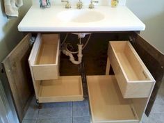 a bathroom sink with drawers underneath it