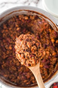 A wooden spoon holds a spoonful of southern homemade chili above a potful of chili. Chili Stovetop, Easy Homemade Chili, Best Ground Beef Recipes, Easy Main Dishes, Crowd Pleasing Recipes, Chili Recipe Easy, Easy Party Food