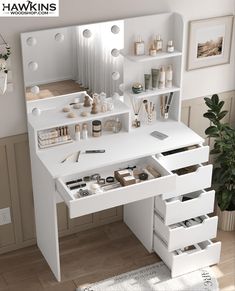 a white desk with drawers and shelves on the top is filled with personal care items