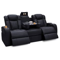 a black reclining sofa with two seats and a table