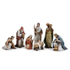 the nativity figurines have been placed in a row on a white background