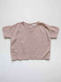 The perfect spring staple, our Muslin Top is a relaxed-fit t-shirt style made from our airy organic cotton muslin. Sizes up to 24mo include a coconut button at the back for easy on and off. • Composition: 100% organic cotton muslin• Available in: SAGE, LEAD GRAY, ANTIQUE ROSE• Made with love in Portugal and India Spring Staples, T Shirt Style, Cotton Muslin, Antique Roses, Muslin Cotton, Made With Love, Free Shopping, Shirt Style, With Love