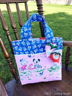 a purse sitting on top of a wooden chair