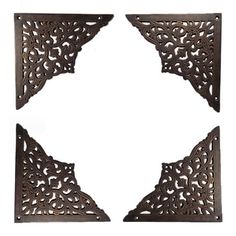 four pieces of metal are shown in the shape of a star, with an openwork design