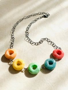 "Each fruit loop is encased in layers of our glitter resin then sculpted! Steel necklace 20\"  Message for any other length." Fruit Loop Necklace, Cereal Necklace, Fruit Loops Cereal, Resin Rainbow, Food Necklace, Loop Necklace, Strawberry Necklace, Fruit Loops, Real Fruit