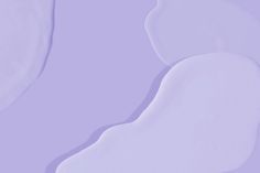 an abstract purple background with wavy shapes