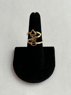 A uniquely designed customized Delta Sigma Theta, Inc. adjustable ring .  The ring comes in 18k gold plated or sterling silver options.  Fits most fingers.  Medium in size- a little over 1/2 inch (~2cm) in width, thickness and height.  You will catch the attention of all your sorority sisters wearing this beautiful ring. * Certified Vendor Sorority Sisters, Letter Ring, Delta Sigma Theta, Greek Letters, Beautiful Ring, Adjustable Ring, Adjustable Rings, Rings Statement, Sorority