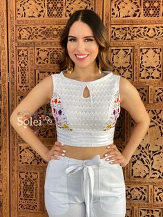 This modern style Two Piece Jumpsuit with a traditional Mexican look is the perfect outfit to add to your wardrobe. It has beautiful hand embroidered flowers, embroidered with Silk Thread and lace details on the Top. The top and pants both have elastic in the back for an adjustable fit. This outfit is made with love by Mexican Artisans in Oaxaca, Mexico. Note: It comes in one size which fits sizes Small and Medium. More colors available here: https://www.etsy.com/es/listing/979071376/jumper-mexi Fitted Sleeveless Tops With Geometric Embroidery, Fitted Sleeveless Top With Geometric Embroidery, Fitted White Blouse With Geometric Embroidery, Fitted Summer Embroidered Top With Geometric Design, Fitted Embroidered Top With Geometric Design For Summer, Fitted Summer Embroidered Top With Geometric Embroidery, Fitted Summer Top With Geometric Embroidery, Flowers Embroidered, Mexican Fashion