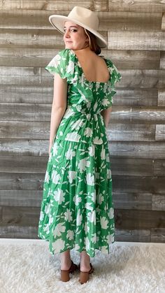 FINAL SALE this green and white floral dress from wishlist is giving me vacay vibes! perfect for a night out, sipping your favorite bev. it's also a lovely dress for a summer wedding or a bridal shower. a maxi dress with flutter sleeves, an elegant neckline, smocking at the waist and back, with a tiered skirt. it's lined and has pockets. you will look timeless in this dress. pair with some subtle jewelry and accessories and the perfect sandals to complete the look! our model is wearing a size sm Green Maxi Dress With Floral Print For Garden Party, Spring Green Floral Print Maxi Dress, Green Floral Maxi Dress For Garden Party, Green Floral Print Maxi Dress For Spring, Green Maxi Sundress For Brunch, Green Sundress Maxi Dress For Brunch, Green Sundress For Summer Garden Party, Spring Green Floral Print Midi Dress, Green Midi Floral Dress For Vacation