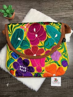 "Very cute Floral Embroidered Messenger Bag from Chiapas, Mexico Overview * Thread material * Suede material * approximate measurements: 9.5x10\" inches * handmade Care * hand wash only * delicate care * hang dry Please email me your questions before buying. All of my items come from a smoke and pet free environment. I WILL BE PROCESS YOUR ORDER IN 1-2 DAYS. If you need the item expressed shipped please contact me to request it and the listing will be adjusted to provide that option. Otherwise y Yellow Embroidered Bag For Daily Use, Green Shoulder Bag With Floral Embroidery, Traditional Multicolor Bag With Floral Embroidery, Traditional Bags With Floral Embroidery For Daily Use, Traditional Multicolor Shoulder Bag With Floral Embroidery, Hand-stitched Rectangular Bag With Multicolor Embroidery, Traditional Embroidered Shoulder Bag For Everyday Use, Yellow Embroidered Tote Bag, Rectangular Bag With Multicolor Embroidery And Hand-stitched Details