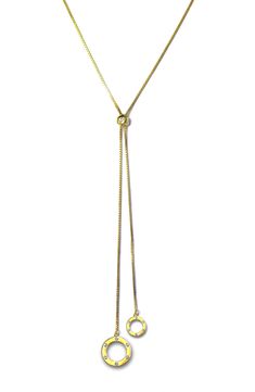 Perfect to layer or wear solo, this 18-karat gold-plated lariat necklace suspends two open circles with dainty cubic zirconia for elegant shine. 30" length; 1" extender; 1/2" diameter pendant 18k-gold plate/cubic zirconia Made in the USA Gold Cubic Zirconia Lariat Necklace, Gold Pendant Lariat Necklace For Anniversary, Yellow Gold Lariat Necklace, Gold Plated Yellow Gold Lariat Necklace, Gold-plated Lariat Necklace, Yellow Gold Plated Lariat Necklace, Anniversary Pendant Lariat Necklace With Adjustable Chain, Gold Adjustable Round Lariat Necklace, Adjustable Chain Lariat Necklace With Cubic Zirconia