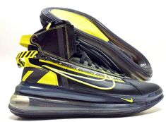 a pair of nike shoes with yellow and black accents on the soles are shown