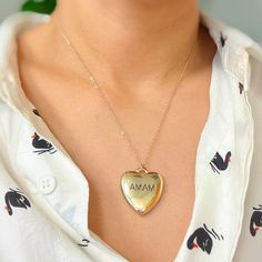 This Mama Engraved Heart Pendant Necklace is perfect for any mother. The heart lock pendant is nice and heavy, giving it a quality look and feel. With the word "mama" engraved, it adds a sentimental touch. Plus, the longer chain allows for versatile styling options. Show your love and appreciation with this timeless piece.Dimensions: approximately 18" chain with a 3" extenderLead and Nickel compliantMade In: China Jewlery Earrings, Heart Pendant Necklace Gold, Lock Pendant, Heart Lock, Hair Setting, Scrunchie Hairstyles, Steel Jewelry, Hair Accessories Headbands, Stainless Steel Jewelry