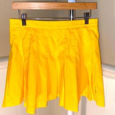 Brand New Ventige Le Coq Sportif Yellow Pleated Mini Skirt Size 10. Color Yellow! Yellow Pleated Tennis Skirt For Spring, Spring Yellow Pleated Tennis Skirt, Preppy Flared Skort With Lined Skirt, Yellow Pleated Mini Skort, Yellow Fitted Pleated Tennis Skirt, Fitted Yellow Pleated Tennis Skirt, Yellow Mini Pleated Skort, Preppy Yellow Bottoms For Spring, Yellow Pleated Skirted Skort