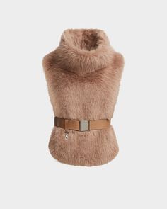 The MAULIN by RUDSAK is a luxe faux fur vest with a chic mock-neck pullover design. Featuring vegan leather side belts and removable waist belt, along with discrete front pockets, this ultra-soft faux fur vest is perfect for layering over sweaters and dresses, adding sophistication to any outfit. Its versatile design offers warmth and style, making it an ideal choice for cooler weather. The MAULIN vest combines comfort and elegance, creating a refined statement piece for the modern wardrobe. Leather Varsity Jackets, Parka Vest, Moto Biker Jacket, Wool Trench Coat, Faux Fur Vest, Knitwear Dress, Outerwear Outfit, Faux Fur Vests, Modern Wardrobe