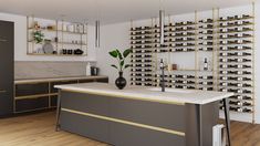 a modern kitchen with gold accents and wine racks