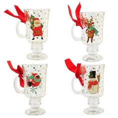 three glass mugs decorated with christmas images and red ribbon tied around the cups, all in different designs