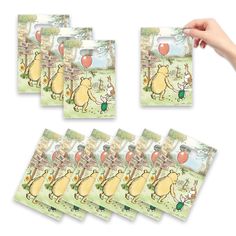 the winnie the pooh stickers are being held up