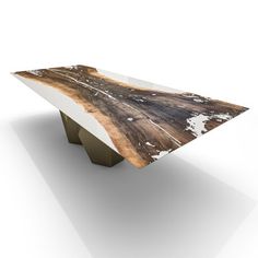 a wooden bench with white paint on it's sides and an abstract design at the top