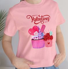 Cute Valentine's Jersey Short Sleeve Tee, Happy Valentine's Day cupcakes tshirt. Be Mine gift for Valentine's Day This classic unisex jersey short sleeve tee fits like a well-loved favorite. Soft cotton and quality print.  These t-shirts have-ribbed knit collars to bolster shaping. The shoulders are tapered for a better fit over time. Dual side seams hold the garment's shape for longer.  .: Made with 100% Airlume combed and ring-spun cotton, a lightweight fabric (4.2 oz/yd² (142 g/m that is easy to layer, breathable. Perfect for active and leisure wear.  .: The retail fit that is perfect for casual and semi-formal settings. The crew neckline adds a classic, neat style that's perfect for accessorizing. .: Bella+Canvas manufactures all its products in the US and internationally in humane, no Happy Valentinstag, Valentine Day Cupcakes, Be Mine, Happy Valentine's Day, Happy Valentine's, Leisure Wear, Happy Valentines Day, Jersey Shorts, Happy Valentine