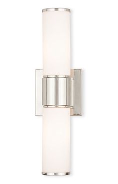 a wall light with a white glass shade on the side and chrome trimmings