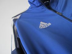 "Vintage Blue Adidas Jacket Blue Adidas Zipper Running Jacket Unisex Jogging Parka Blue Soccer Jacket Three Stripes Size Large Adidas Cardigan Label size: D 176; GB 34/36; F 16A Measurements: (lying flat) Length - 28.5\"/ 72.5 cm Shoulders: 20\"/ 51 cm Pit to pit: 22.5\"/ 57 cm Waist: 19.5\"/ 49.5 cm Sleeve: 22.5\"/ 57 cm Please check measurements to insure a proper fit. Remember to allow yourself some extra room for movement. You can compare these with something from your closet that fits you w Blue Sports Track Jacket With Zipper Closure, Blue Sports Outerwear With Zipper Closure, Blue Sporty Track Jacket With Zipper, Blue Long Sleeve Track Jacket For Outdoor, Blue Sportswear Track Jacket For Fall, Blue Track Jacket For Fall Sportswear, Blue Track Jacket For Fall, Dress 70s Style, Adidas Jumper