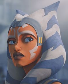 a close up of a woman with blue eyes and a hood on her head, wearing a star wars costume