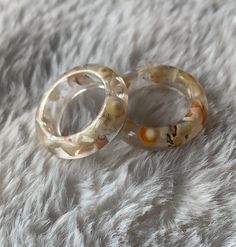 handmade clear resin rings with little seashells inside! sizes of rings are in UK ring sizing, any queries please message me  to keep good care of your jewellery: * avoid leaving in direct sunlight  * remove before showering or exercising * if wet, dry with towel  * any issues with your purchase, please contact me for a refund or replacement  Check out my Instagram @sophsearringshop ♥️ Interesting Rings, Seashell Resin, Ocean Ring, Diy Jewelry Rings, Resin Rings, Side Business, Shell Ring, Mother Of Dragons, Resin Ring