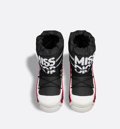 Part of the DiorAlps capsule, the après-ski boot features the white Miss Dior Graffiti motif, a nod to 1967's debut ready-to-wear collection and a manifesto to Maria Grazia Chiuri's hallmark celebration of feminism. The black shiny nylon upper is completed by cross lacing for an optimal fit. The Christian Dior signature adorns the supple, lightweight three-tone white sole, embellished with the emblematic star. Featuring a low silhouette, the technical ankle boot can be worn in either the city or Apres Ski Boots, Maria Grazia Chiuri, Maria Grazia, Apres Ski, Miss Dior, Christian Dior, Black Boots, Skiing, Graffiti