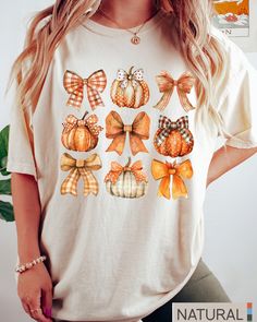 Retro Fall Pumpkin Bow Shirt, Fall Coquette Bow Sweatshirt, Autumn Pumpkin Tee, Fall T-Shirt , Autumn Sublimation Design, Autumn Bow Shirts -UNISEX T-SHIRTS - Women typically wear one size down for a fitted look. -The Models in the pictures are wearing 2 sizes up, Please order 2 sizes up for an oversized look DETAILS AND FABRIC: * Comfort Colors 1717 * 100% ring-spun cotton How you order: Select your size and the color that you want from the drop down bar, add to cart, and check out.  How to ord Cute White Tops For Fall, Fall Graphic Tee With Sublimation Print, Cute Orange Crew Neck Top, White Short Sleeve Top For Fall, Fall Cotton Top With Sublimation Print, White Sublimation Print Top For Fall, Cute Short Sleeve Tops For Fall, Cotton Top With Sublimation Print For Fall, Cute White Fall Shirt