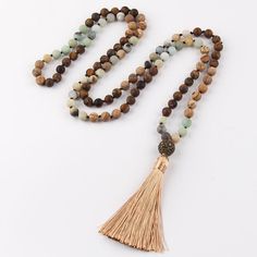 Bohemian Tribal Stone Beaded Necklace with Tassel Pendant Stylish Design Discover the beauty of nature and fashion with this statement necklace showcasing an intricate BOHO tribal stone design. This sophisticated, long strand necklace is the perfect addition to any chic look. Quality Materials Crafted with: Metal: Alloy Material: Semi-Precious Stone Perfect Length With a chain length of 104cm and a pendant length of 10.0cm, this necklace is designed to enhance your wardrobe effortlessly. Timeles Stone Beaded Necklace, Stone Design, Strand Necklace, Chain Lengths, Stone Beads, Stylish Design, Chain Length, Semiprecious Stones, Semi Precious