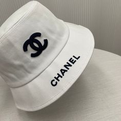 Size: Standard Size It comes with Dust box, Care manual, Tag, and Paper bag. Classic Summer Hat With Embroidered Logo, Classic Summer Hats With Embroidered Logo, Designer White Flat Brim Hat, Designer White Visor Hat, Designer White Hat With Curved Brim, Luxury Summer Cap, Luxury White Visor Hat, Designer White Hats For Spring, Designer White Spring Hat