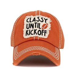 This russ colored baseball cap is a must-have for any football fan. It has a beige embroidered patch on the front that reads "Classy Until Kickoff" and a small orange football. The white stitching on the brim and the panels adds some flair to this simple cap. Whether you are cheering for your team or just hanging out, this cap will keep you stylish and comfortable. * Crown Circumference : 23" (Adjustable) * Crown Height : 4.25" * Brim Height : 2.75" * Material : 100% Cotton Classy Until Kickoff, Gift For Mom Christmas, Football Lover, Mom Hats, Mom Fashion, Football Lovers, Mom Christmas, Sports Baseball, Clothes Horse