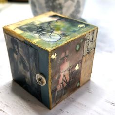 a small decorative box sitting on top of a table